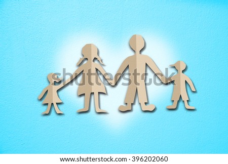Happy family paper cut on cement wall background