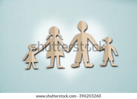 Happy family paper cut on cement wall background

