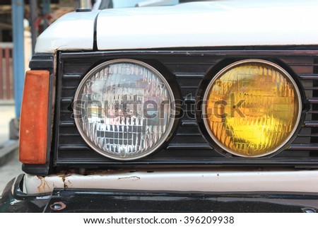 Round car headlight and turn indicator Royalty-Free Stock Photo #396209938