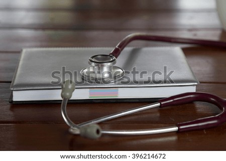  stethoscope on notebook.medical concept