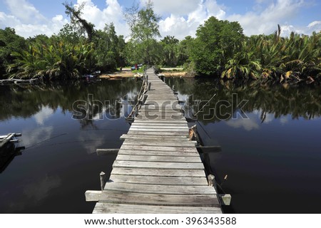 Beautiful composition view of old jetty during the daylight with the reflection of nature.Vibrance colour. Motion Blur, Soft Focus due to Slow Shutter Speed. Copy Space Area