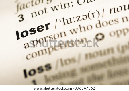 Close up of old English dictionary page with word loser