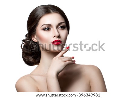 Portrait of a beautiful young woman with a professional make-up on a white background. The ideal beauty. Red lips. Professional makeup. Stock Photo Cosmetic Advertising and skin care products