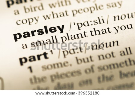 Close up of old English dictionary page with word parsley