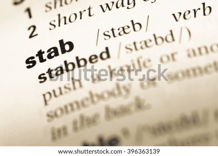 Close up of old English dictionary page with word stab