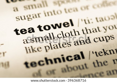 Close up of old English dictionary page with word tea towel