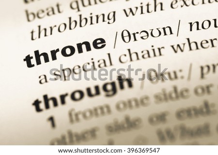 Close up of old English dictionary page with word throne