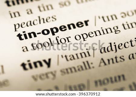 Close up of old English dictionary page with word tin opener