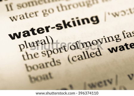Close up of old English dictionary page with word water skiing