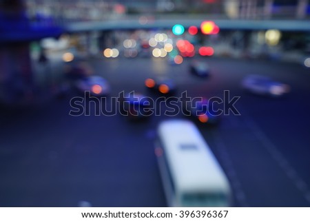 Artistic style - Defocused urban abstract texture bokeh city lights & traffic jams in the background with blurring lights.