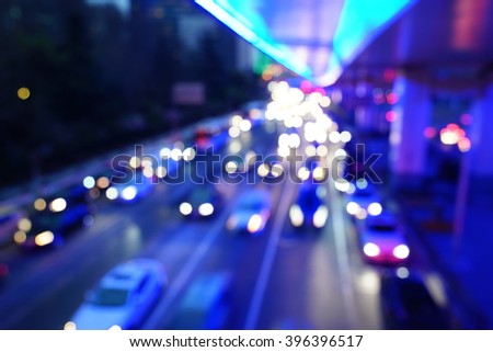 Artistic style - Defocused urban abstract texture bokeh city lights & traffic jams in the background with blurring lights.