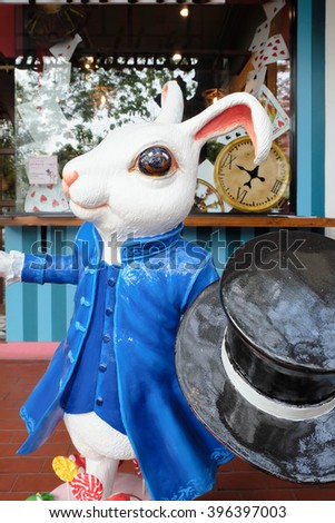 Portrait Statue of White Rabbit in a Blue Suit with Magical Top Hat, Selective focus on the eye. Alice in Wonderland concept.