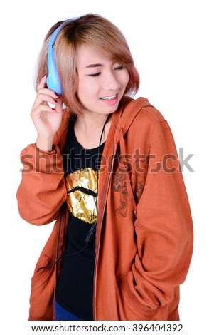 Woman listening to music on white background.