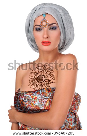 beautiful stylish woman in oriental style  wearing in turban isolated in white background