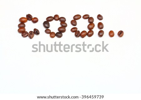 the word cool is laid out coffee beans on the isolated white background