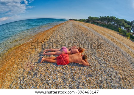 Young Couple Relaxing on a Skala Beach in Kefalonia, Greece