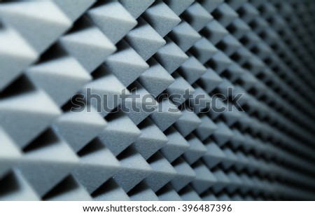 Dampening acoustical foam on recording studio wall