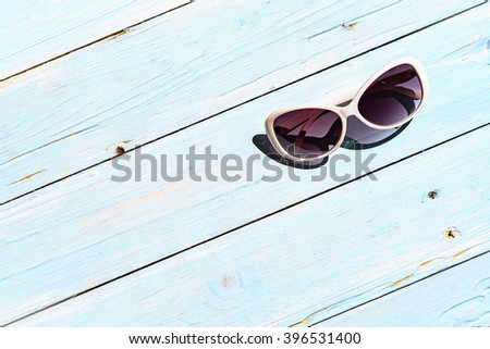 Sunglasses on wood table, Summer accessory