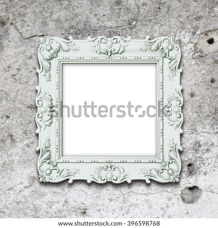 Close-up of one aqua decorated picture frame on weathered wall background