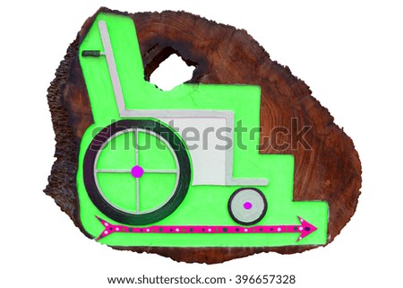Wheelchair label on wood board, Background have Green color and Hot Pink arrow pointing to the right side, isolated on white background