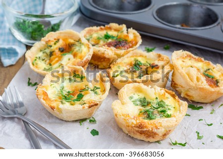 Mini quiche with bacon Royalty-Free Stock Photo #396683056