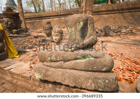 The old Buddha statue and moss at Tunnel Temple (Wat U-mong), Chiang Mai Province, Northern Thailand