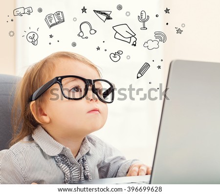 E Learning concept with toddler girl using her laptop