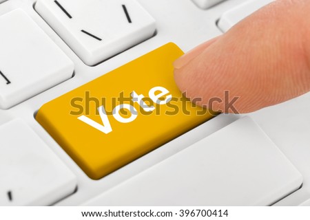 Computer notebook keyboard with Vote key - technology background