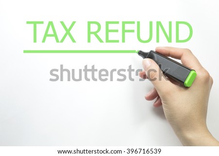 Hand writing tax refund with green marker on transparent wipe board.