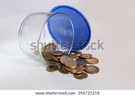 Indian coins in glass jar, savings