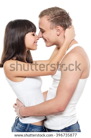 Young and happy beautiful couple in love. Photo isolated on white background.