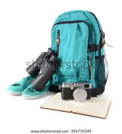 Tourism concept. Backpack, binocular and camera isolated on white background