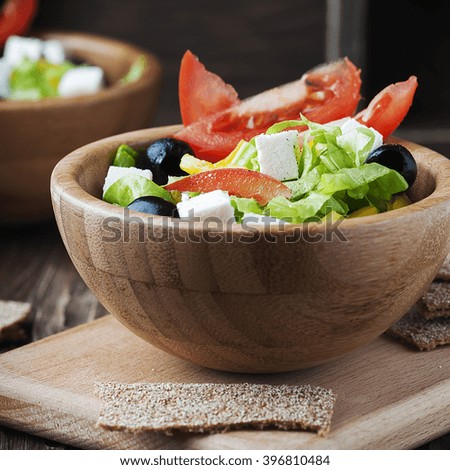 Fresh Greek salad with olive oil, selective focus and square image