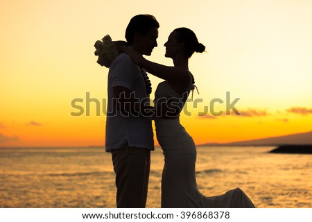 Bride and groom in a romantic beach setting. 