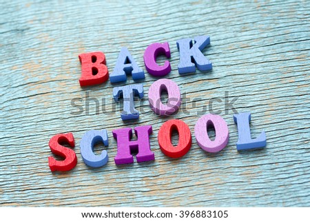 Back to school phrase made of wooden colorful letters on vintage background