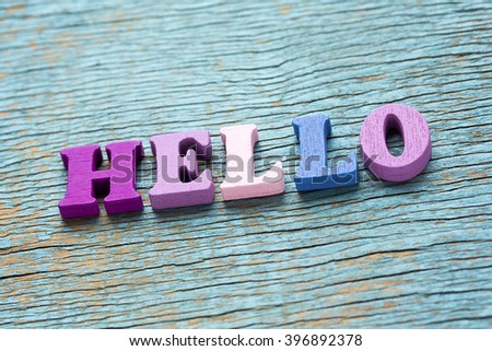 Word Hello made of wooden colorful letters on vintage background