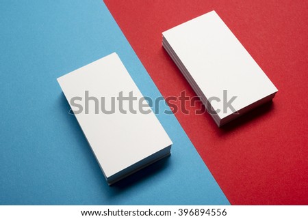 Business card blank over colorful abstract background. Corporate stationery branding mock-up
