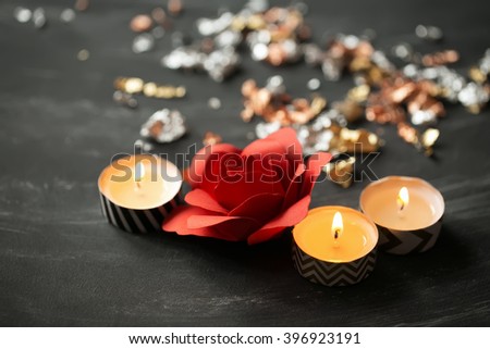 Close-up of candles and  flower