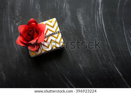 Stylish gift with red rose 