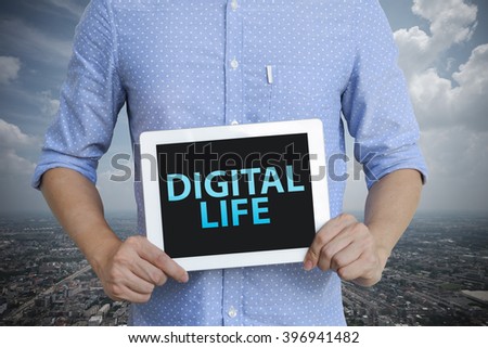 young man showing digital tablet with WEB DIGITAL LIFE in city , business concept ,business idea , analysis concept