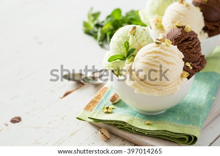 Colorful ive cream scoops in white bowl, copy space Royalty-Free Stock Photo #397014265