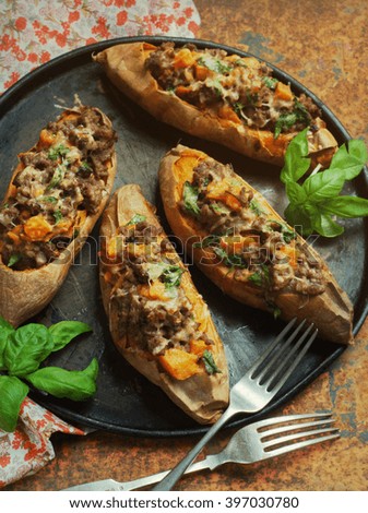 stuffed sweet potato with spiced beef and herbs. selective focus