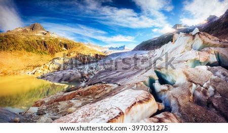 Gorgeous sunny day on the Rhone glacier in the Alpine valley. Picturesque scene. Location famous resort: Bernese Alps, Furkapass and Grimselpass, Swiss, Europe. Artistic picture. Beauty world.