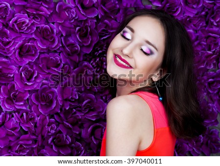 beautiful young brunette teenage girl   with makeup and dark hair in the studio