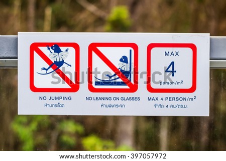 Prohibition signs are in English and Thailand.