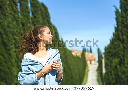  Young attractive woman making selfie on Tuscan road