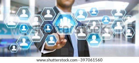 Businessman using digital social network interface