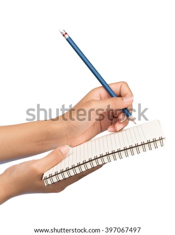 Hand with pencil writing in open notebook isolated on white background