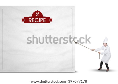 Picture of Indian woman wearing chef uniform and drags a billboard with recipe text, isolated on white background