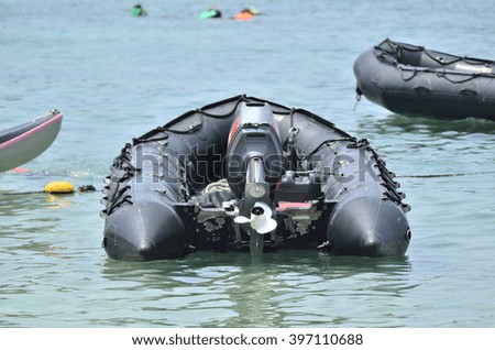 inflatable boat on the ocean (Back side - Selective focus)